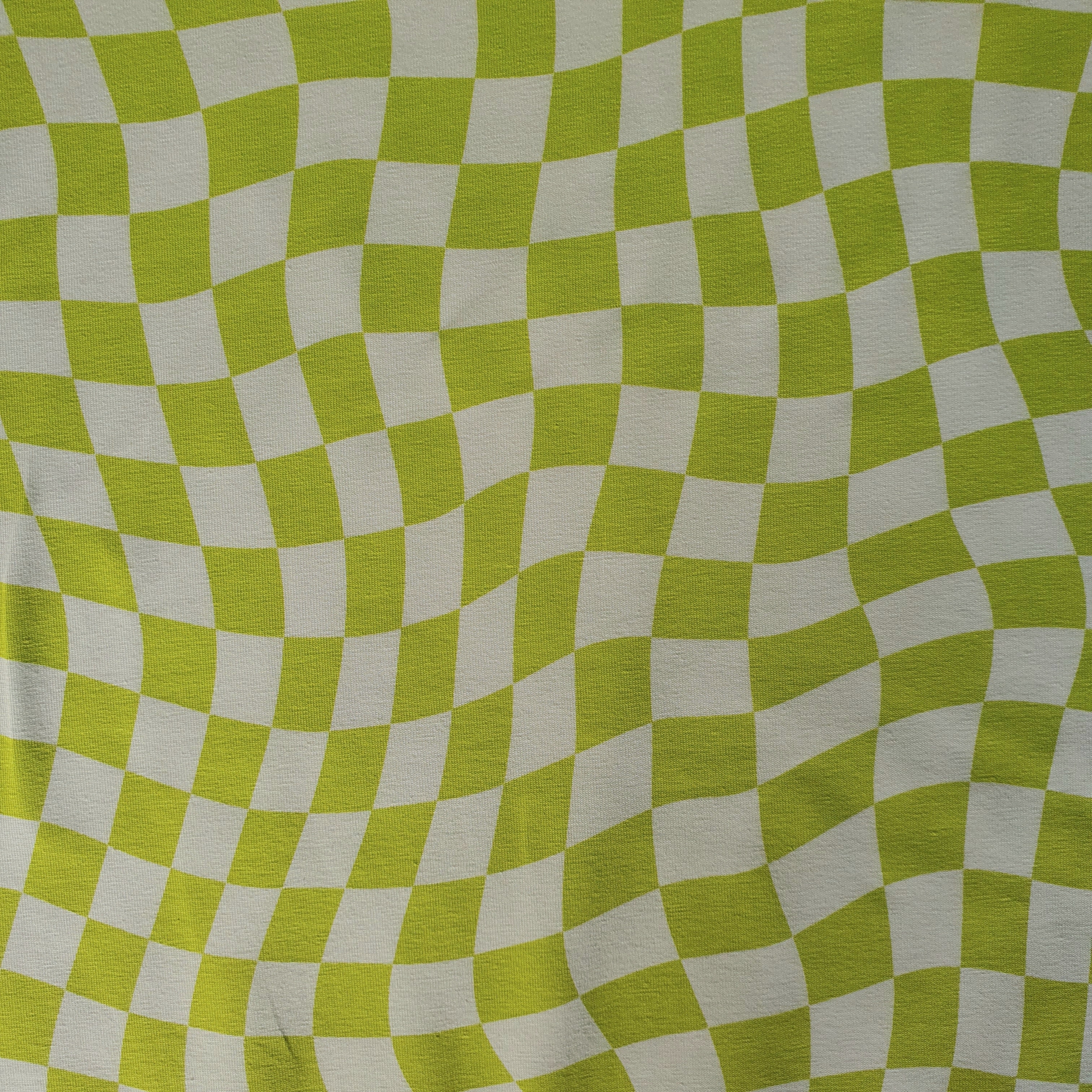 Tissu jersey damier asymétrique vert pomme et blanc