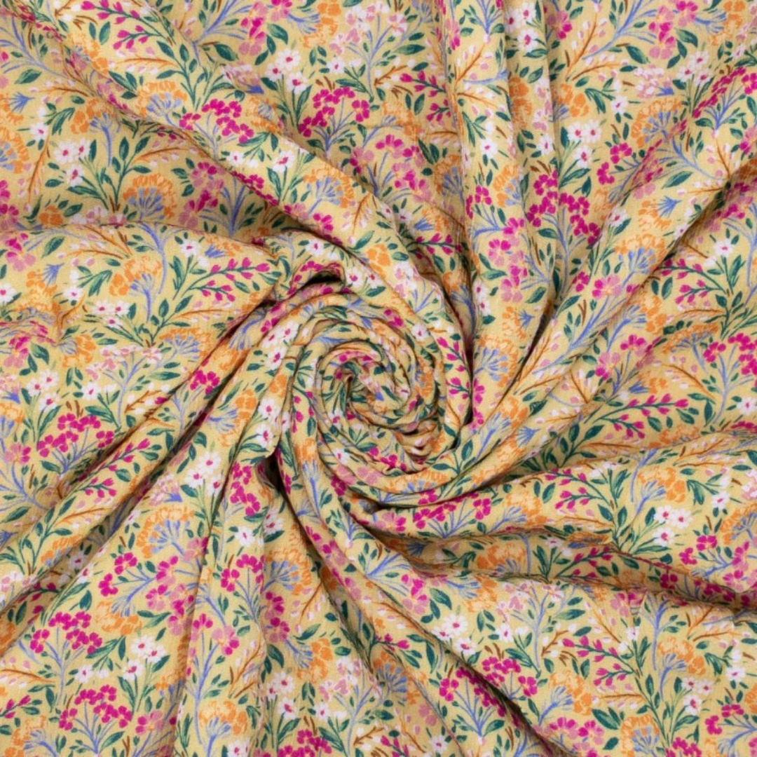 Tissu viscose fleuri rose sur fond jaune (1)