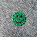 Patch thermocollant rond tête de smiley brillant vert