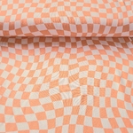 Tissu jersey damier asymétrique saumon et blanc