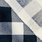 Tissu polaire TEDDY écru et bleu marine à carreaux.