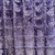 Tissu fausse fourrure violet à carré