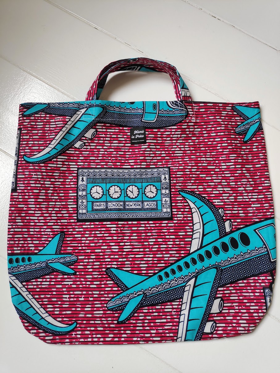 sac julia:avions bleu turquoise sur fond rouge