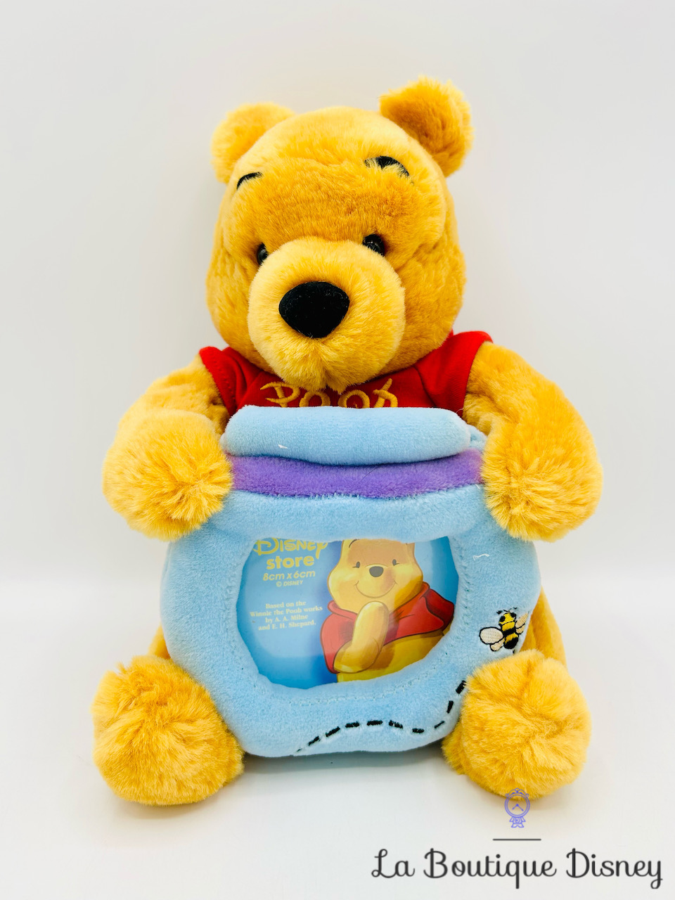 Peluche Cadre Winnie l\'ourson pot de miel Disney Store photo bleu 24 cm