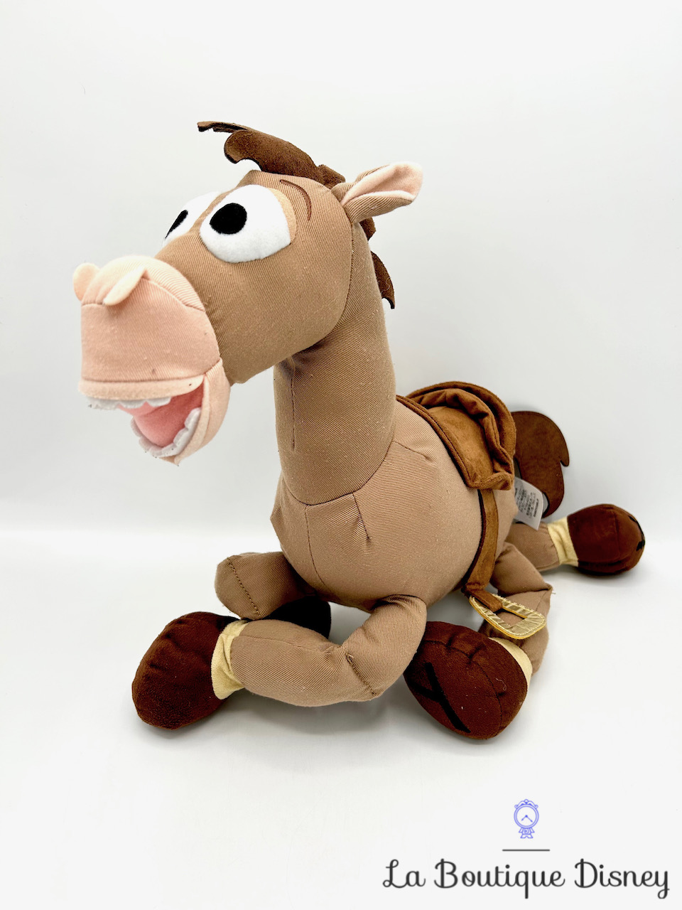 Peluche Pile Poil Toy Story Disney Store cheval marron écusson 45 cm