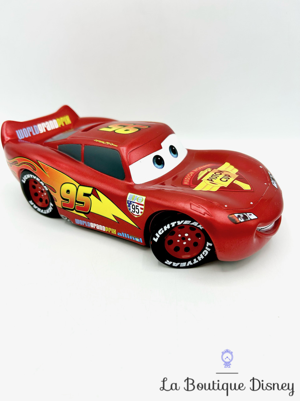 Tirelire Flash McQueen Cars Disneyland Euro Disney voiture rouge Piston Cup plastique 21 cm