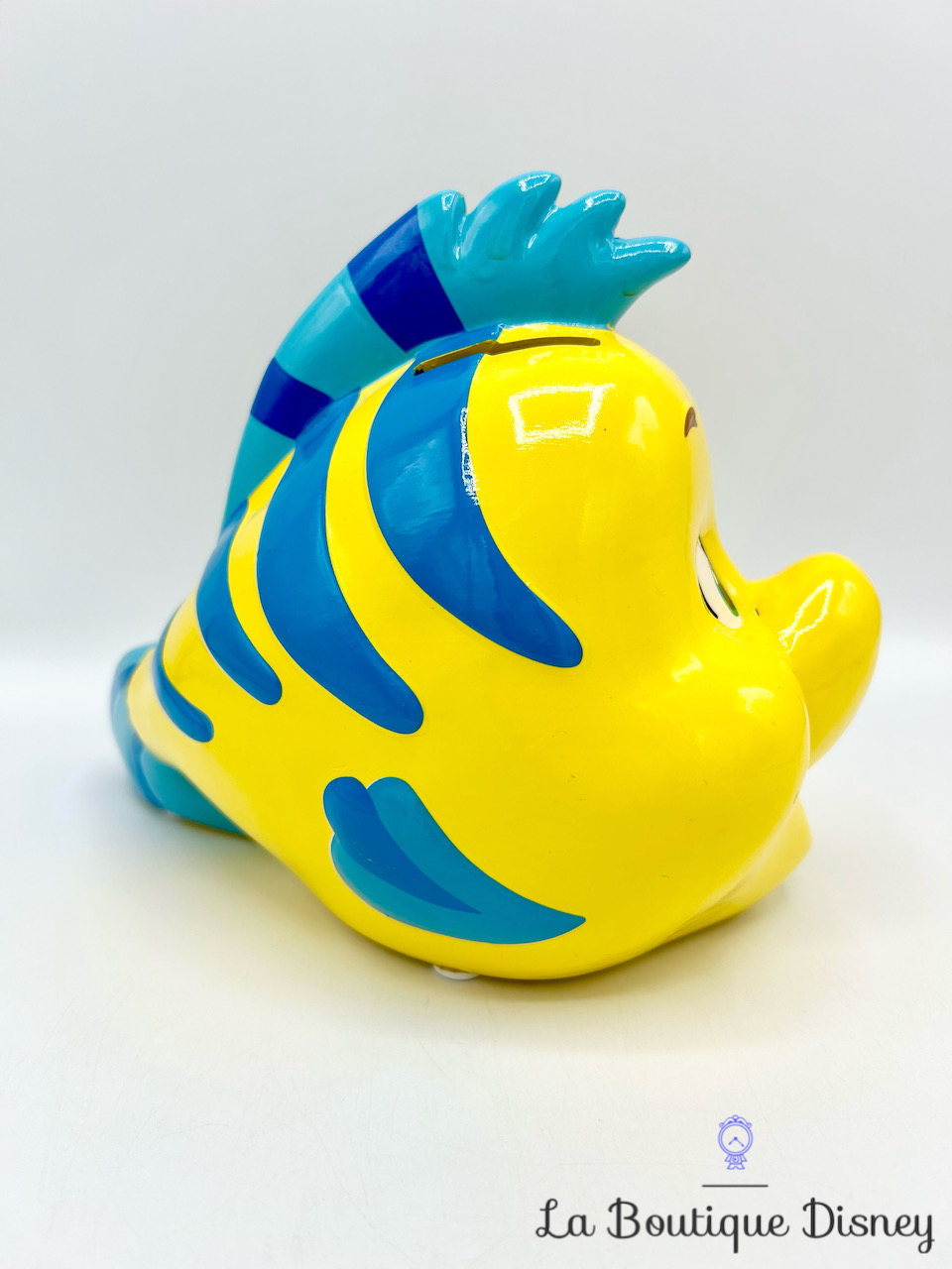 tirelire-polochon-poisson-la-petite-sirène-disney-primark-céramique-jaune-bleu-0