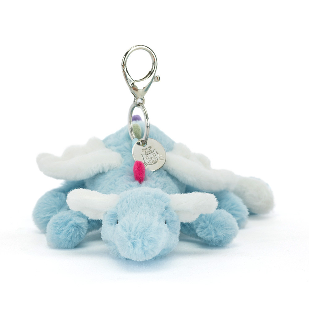 Détail ailes peluche et mousqueton gravé Jellycat bijou de sac dragon.