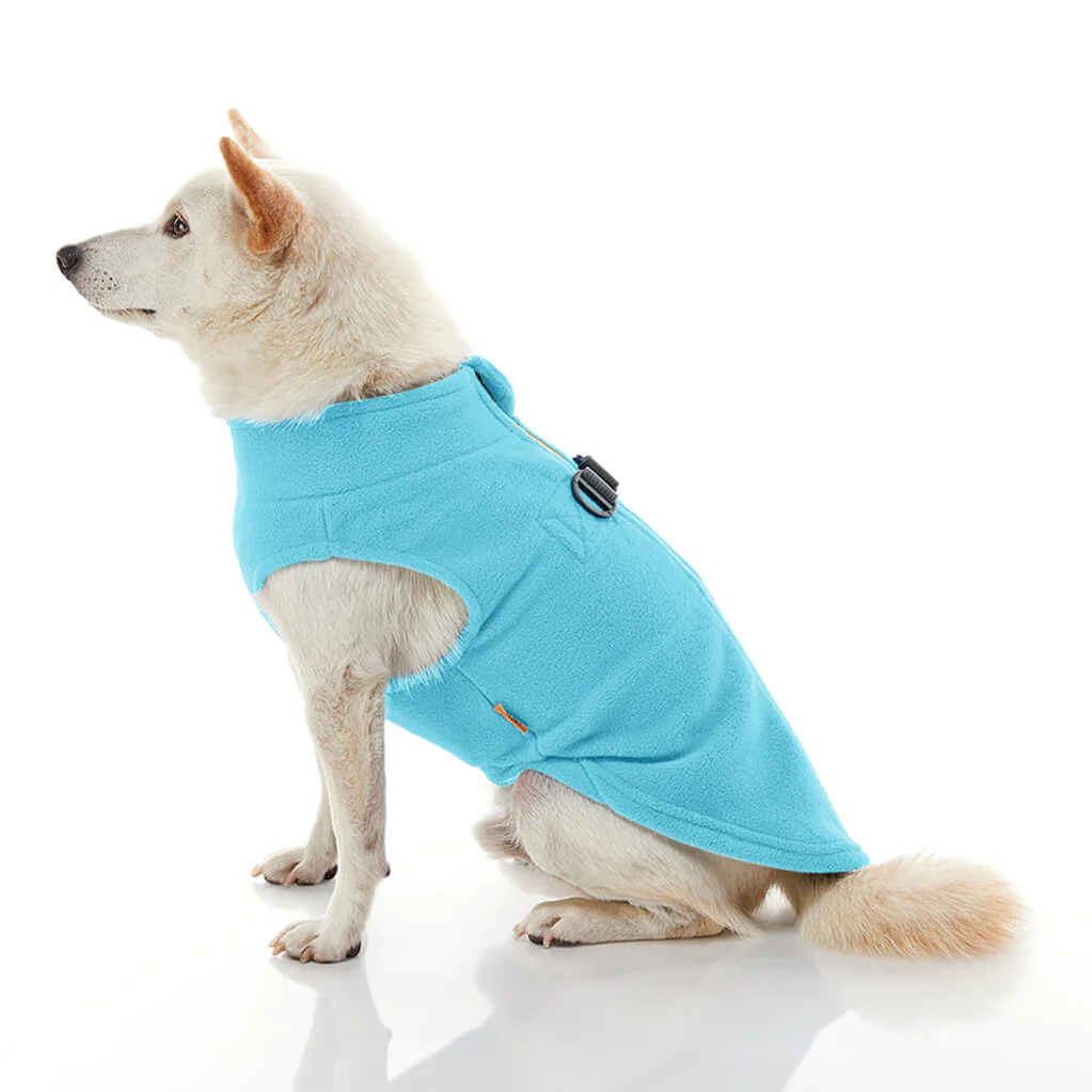 gooby-office-dog-loki-a-white-shiba-inu-wearing-turquoise-zip-up-fleece-vest-sitting-down-side-view-1024x1024px