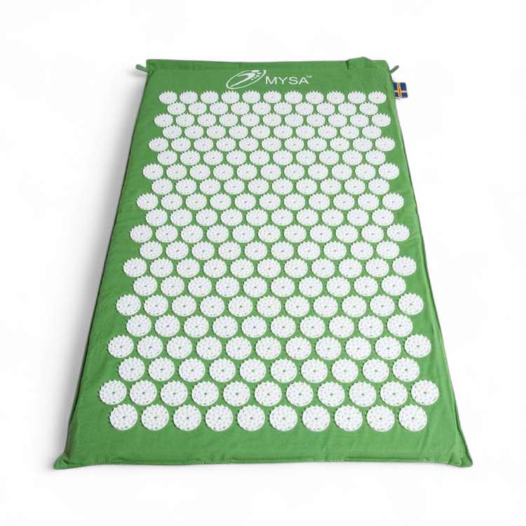 Vue détaillée d’un tapis d’acupression vert avec picots stimulants, favorisant la circulation sanguine.