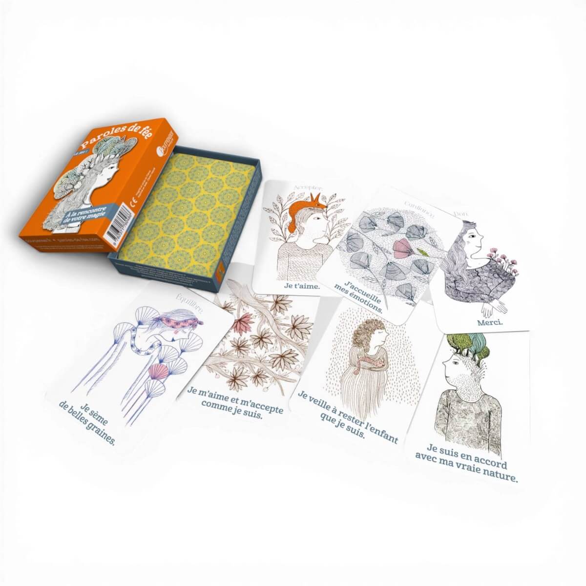 Cartes du jeu Paroles de Fée étalées autour du coffret avec messages positifs et illustrations poétiques