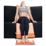 Séance d’acupression sur canapé avec le ThermoMag Mysa Duo XXL et le coussin chauffant ThermoMag
