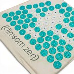 Gros plan des picots du tapis de magnétothérapie Climsom Zen et des disques blancs qui contiennent les aimants