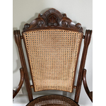 Fauteuil Fischel canné Art Nouveau Autriche coquille sculptée - Galerie Georgette Antiquités Art Nouveau