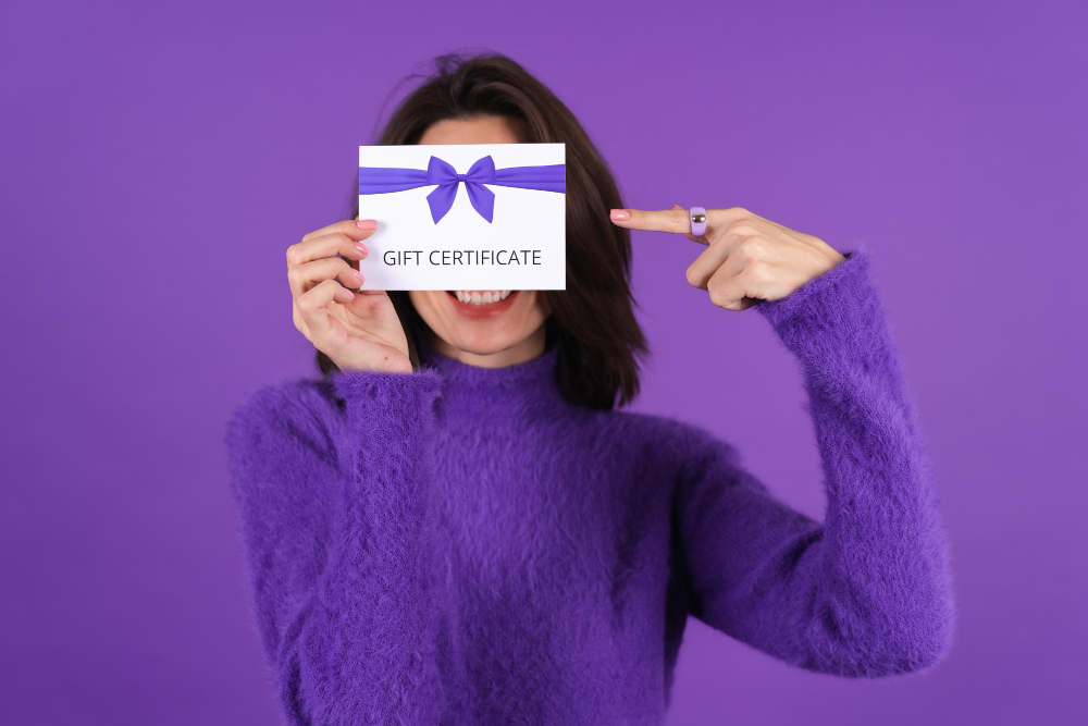 young woman in purple soft cozy sweater with gift voucher