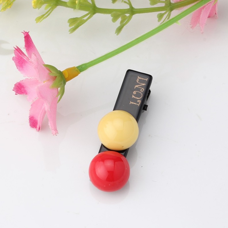 barrette bonbon rouge et jaune pour chien