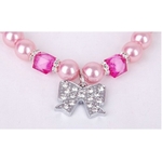 bijoux-de-perles-roses-et-noeud-papillon-pour-chien