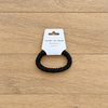Chouchou noir fin sur parquet clair