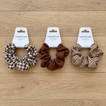 Trois chouchous sur parquet clair