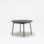Table ronde Unit plateau chêne noir et piètement noir, vue de trois quarts sur fond gris clair