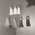 Pompoms blancs gris