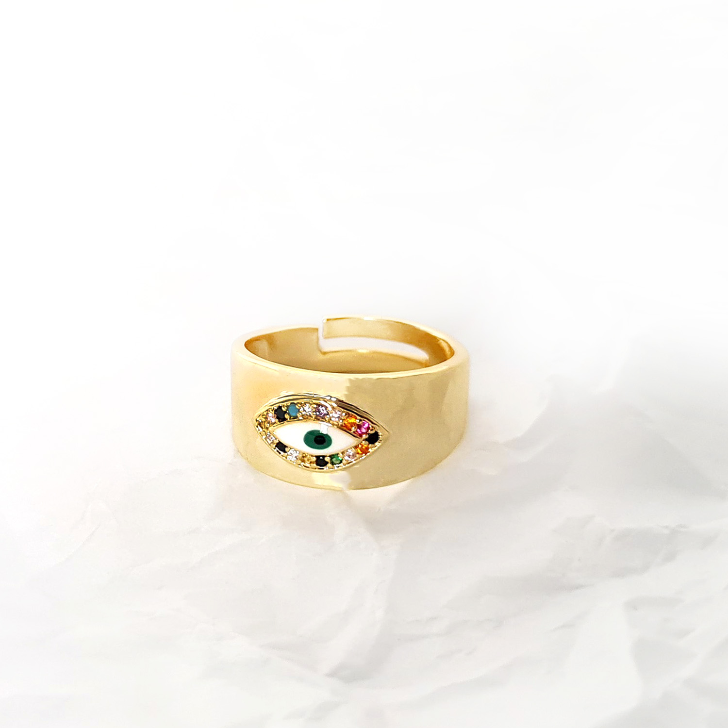 bague-epaisse-oeil-zircon-multicolore-olympe-bijoux-fond-blanc-froisse