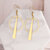 boucles-oreilles-batonnet-olympe-bijoux-fond-marbre