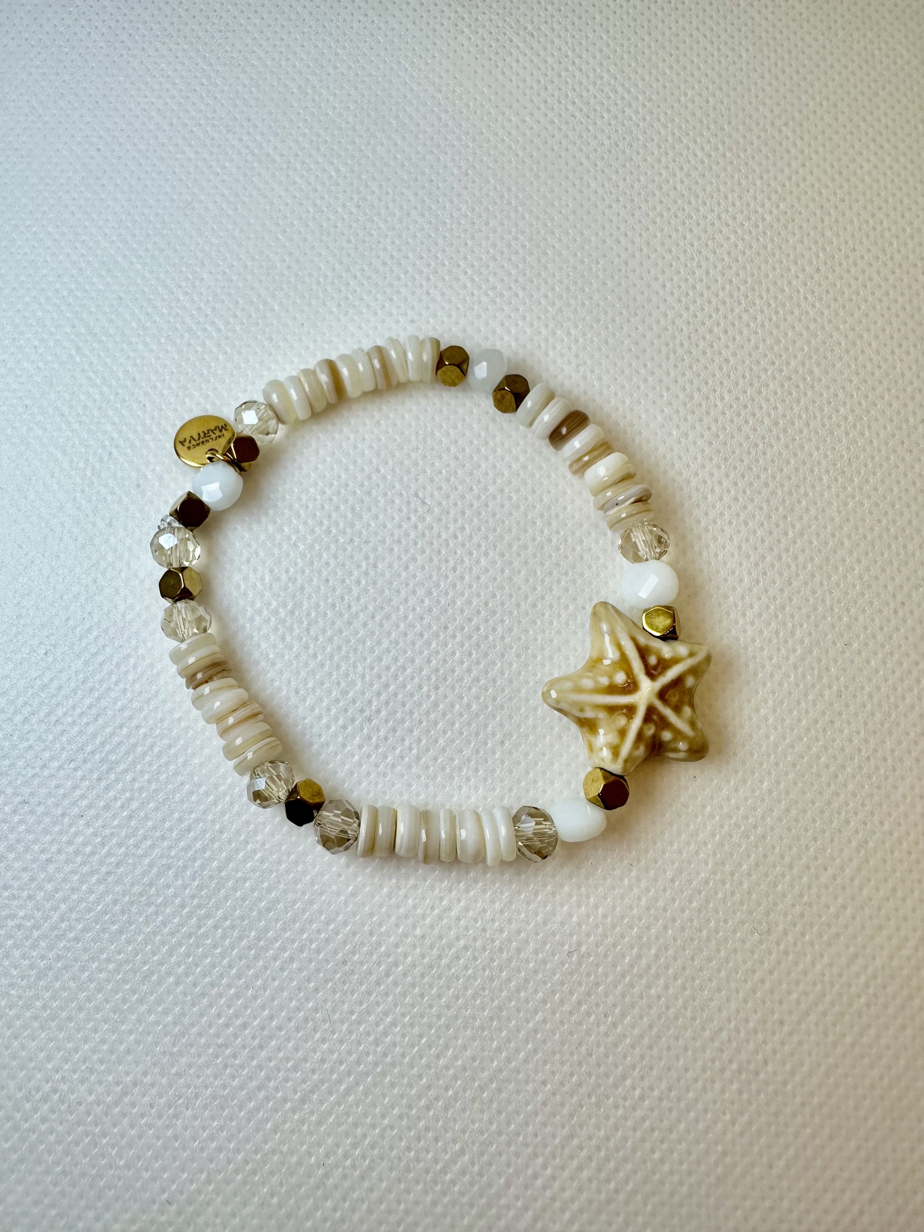 bracelet élastique avec une étoile de mer en céramique, bracelet en coquillage
