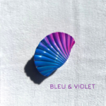 Pince à cheveux violette en forme de coquillage