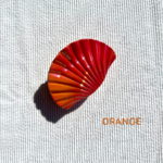 Pince à cheveux coloré orange en forme de coquillage