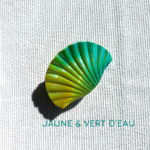Pince à cheveux colorée verte en forme de coquillage