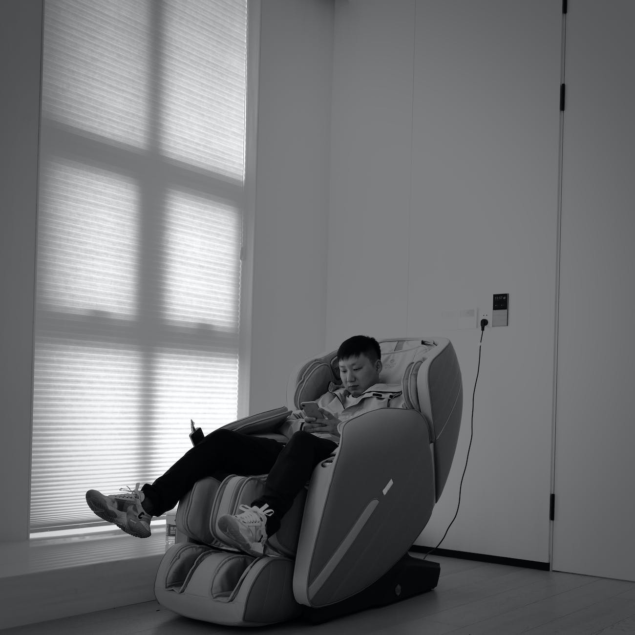 young man sitting in a massage chair
