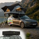 Tente de toit Juskys Lago ouverte sur une voiture au bord d’un lac, et repliée sous sa housse