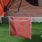 Poche de rangement rouge accrochée au bas de la toile