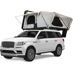 Tente de toit à coque dure, toile blanche, ouverte sur un grand SUV blanc