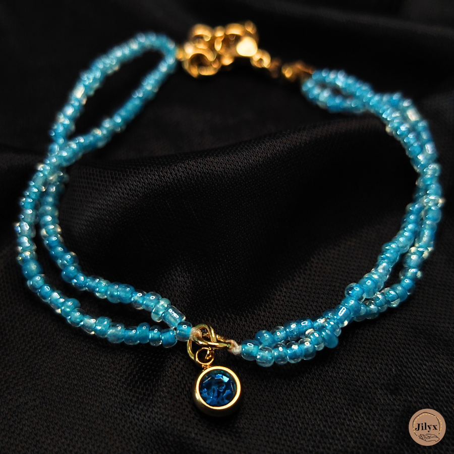 Bracelet double rangée perle bleu pendentif strass satin