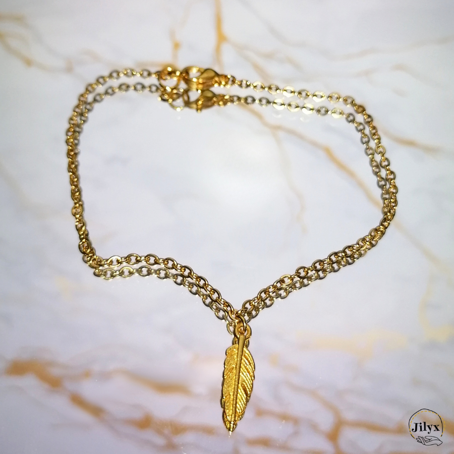 Bracelet pendentif plume doré marbre