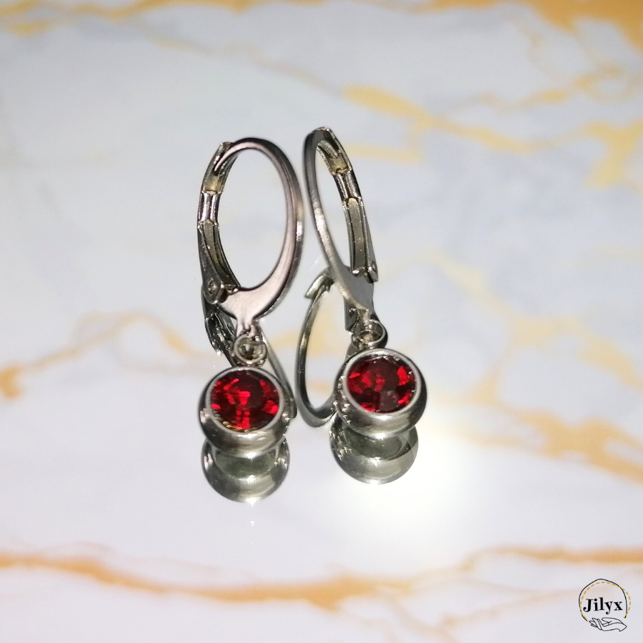 Boucles doreille argentée strass rouge