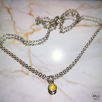 Collier argenté avec pendentif strass jaune marbre