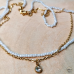 Collier bi matière blanc et doré strass bois