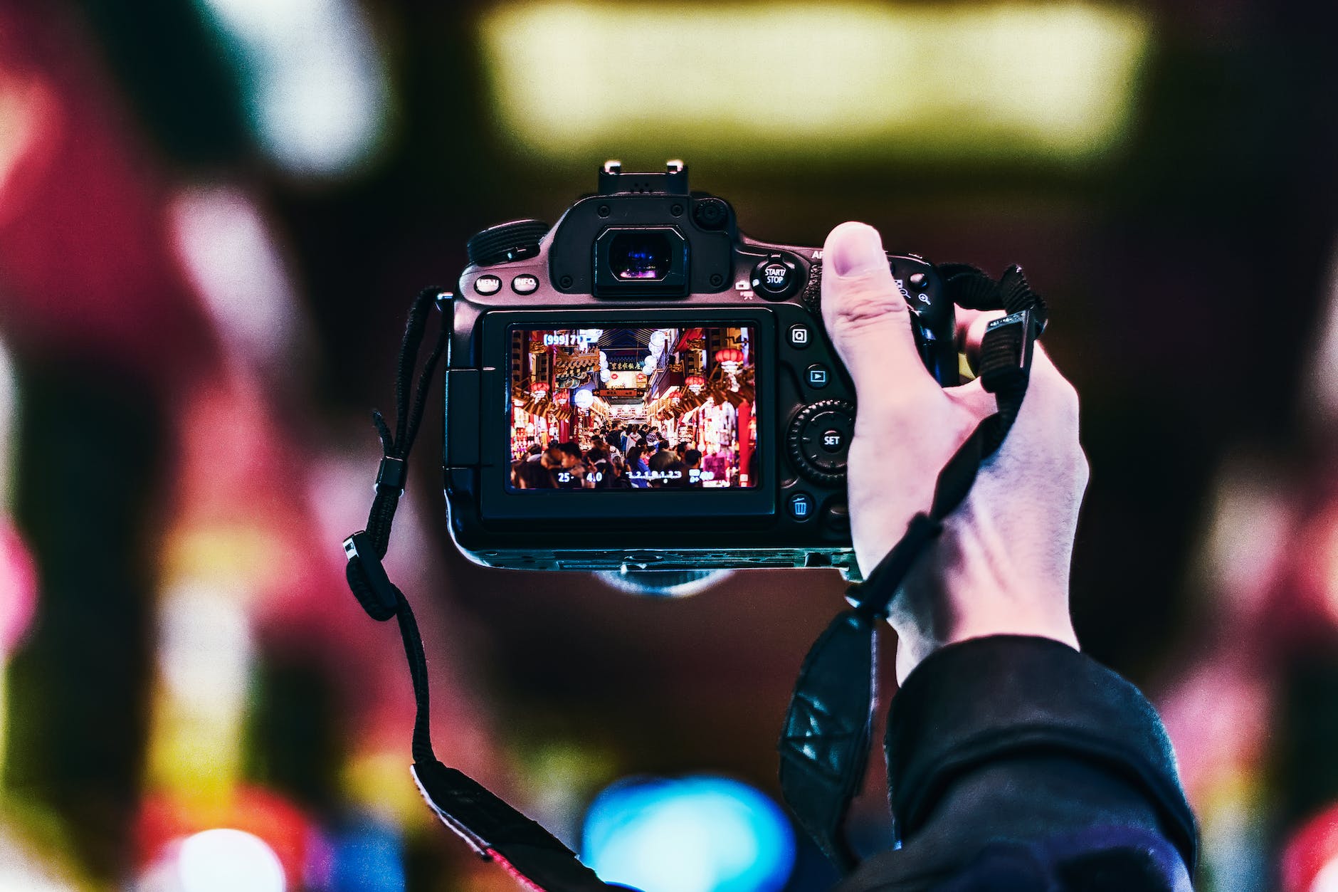 Person Holding Turned-on Camera