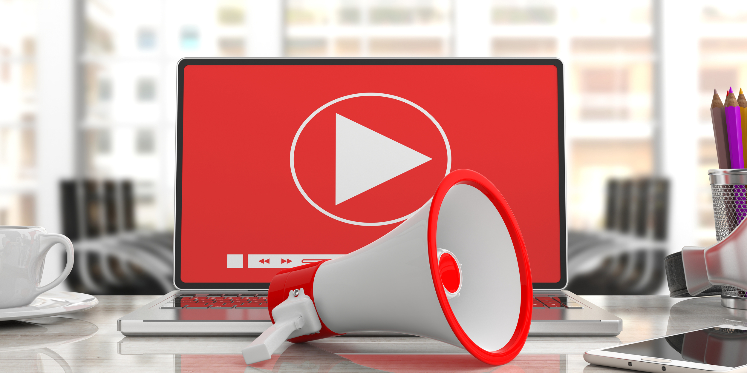megaphone-bullhorn-video-player-computer-screen-blurred-office-background-close-up-view-3d-illustration