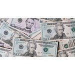 Top view of different types and colors American dollars placed together on each other