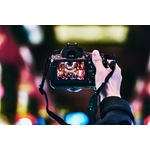 Person Holding Turned-on Camera