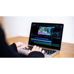 young-content-creator-girl-editing-video-her-laptop-working-from-home