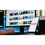 phone-with-youtube-screen-while-person-using-computer
