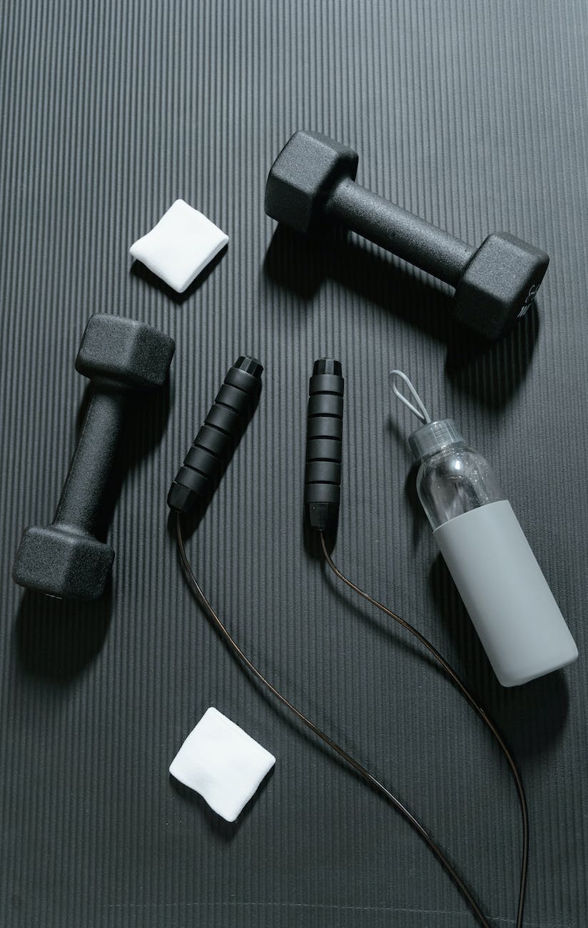 exercise equipment on black rubber floor