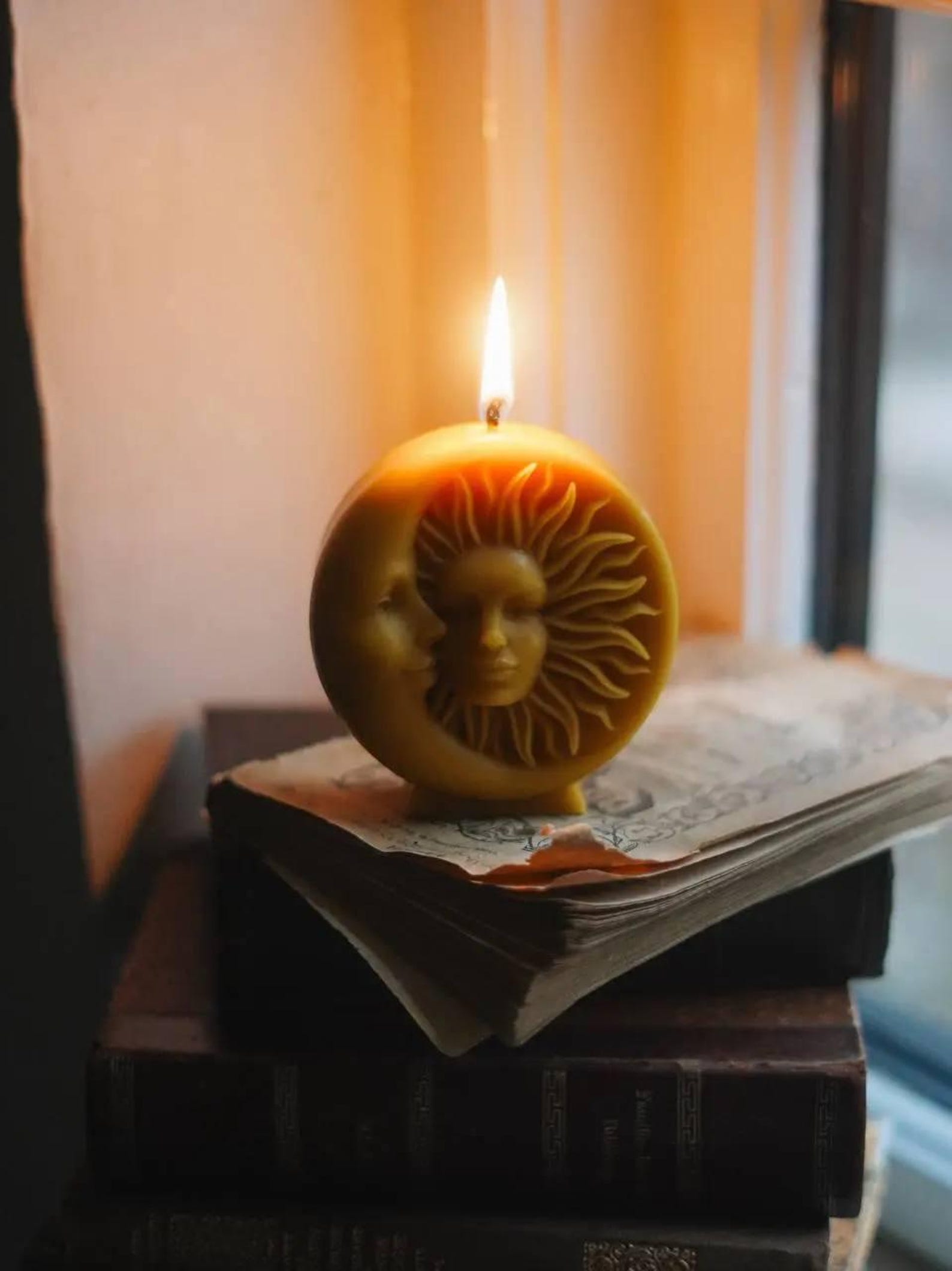Warm lifestyle scene with the Sun & Moon candle in ambient light