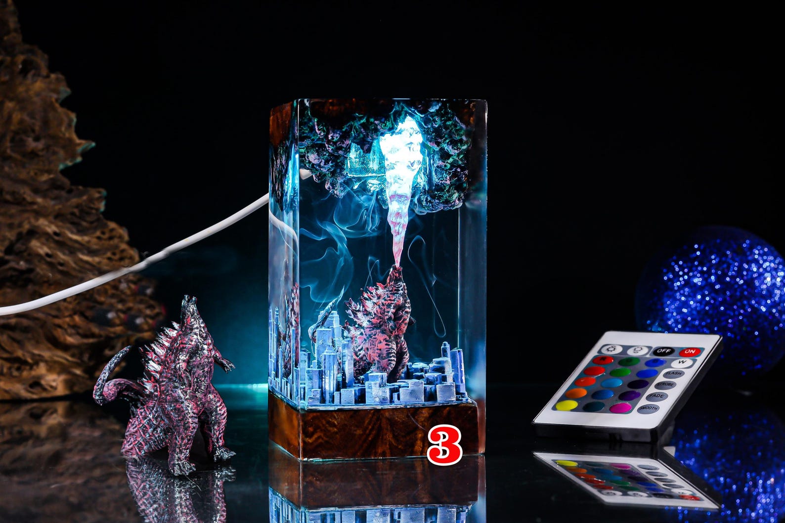 Full-width gallery image of resin anime night lamp with wooden base and glowing LED colors