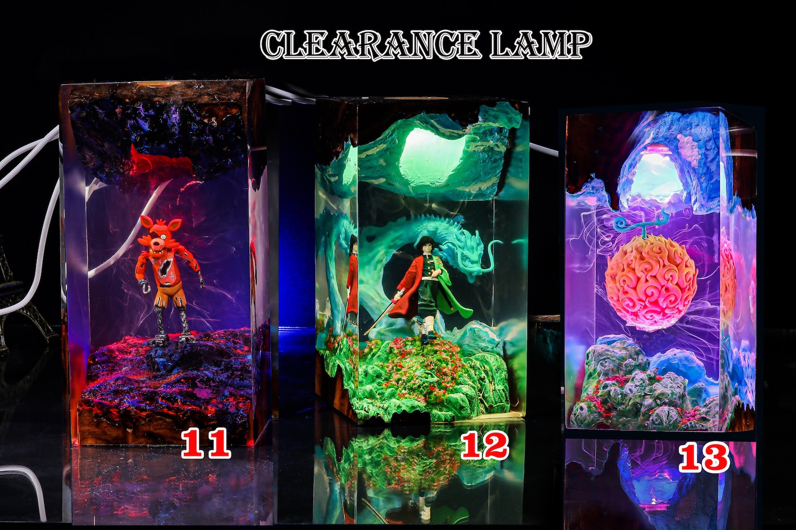 PinkGodz figurine glowing on wooden base with remote control visible